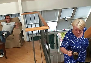Young guy fucks busty blonde granny from behind